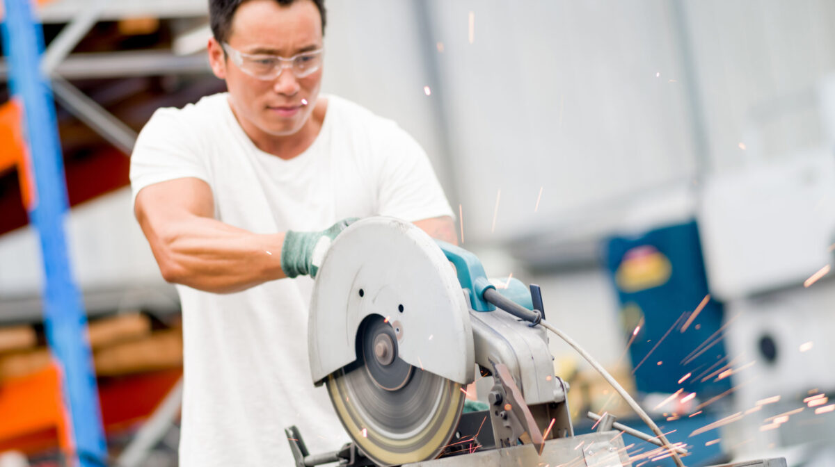 portrait of asian worker in production plant working on the factory floor